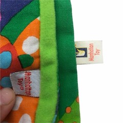 Manhattan Toy soft book ‘Buzzing Through’ tethered toy baby
