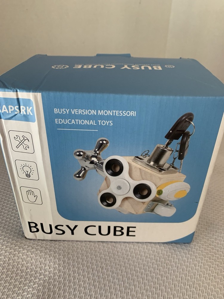 Busy cube designed for toddlers fine motor skills & problem-solving