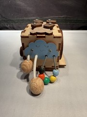 Montessori busy cube designed for toddlers fine motor skills & problem-solving