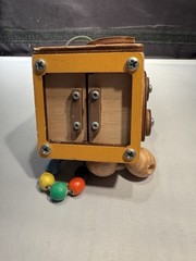 Montessori busy cube designed for toddlers fine motor skills & problem-solving