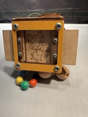 Montessori busy cube designed for toddlers fine motor skills & problem-solving